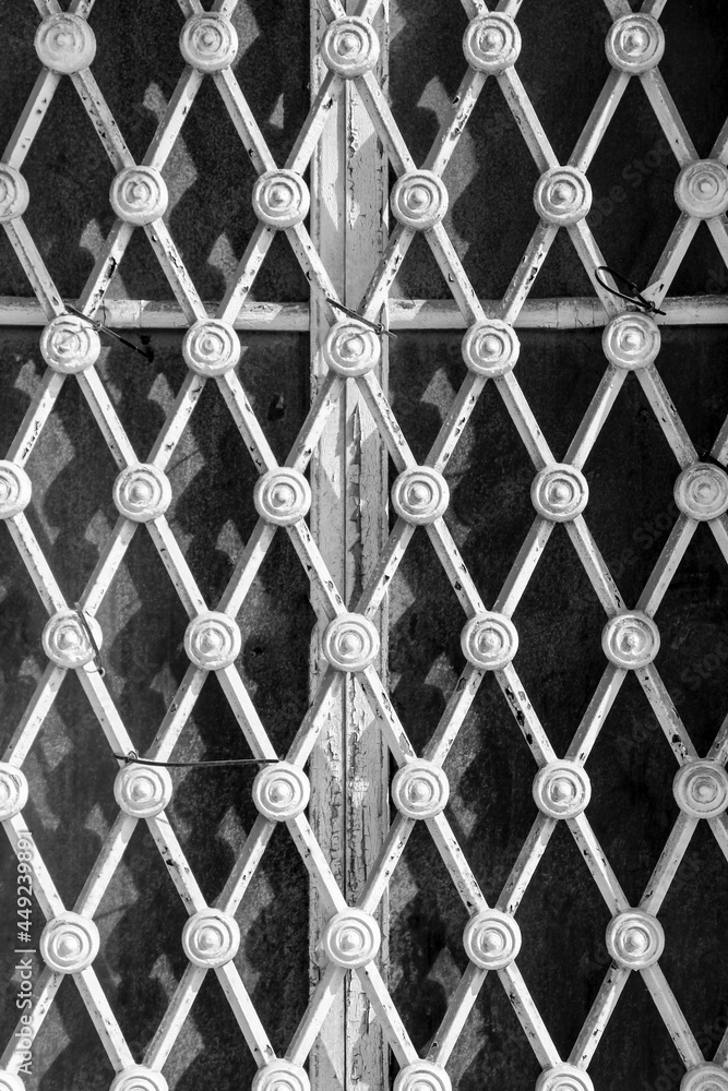 Fototapeta premium Window with metalized abstract and symmetrical grid