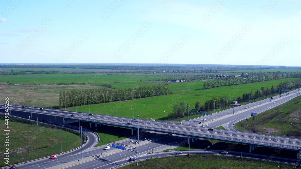 Aerial view of highway and overpass in city on summer day