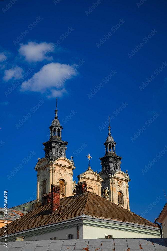 christian church towers cathedral building vertical photography with blue sky background empty space