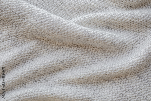 White natural texture of knitted wool textile background, cotton fabric close-up