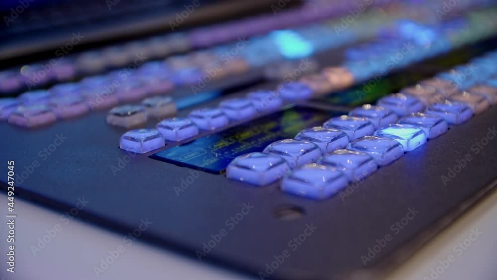 close-up of the brightly illuminated buttons on the director's console. remote control of the TV director during the broadcast 