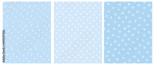 3 Cute Abstract Geometric Vector Patterns. White Hand Drawn Spots, Triangles and Dots Isolated on a Pastel Blue Background. Irregular White Scribbles Print. White Polka Dots on a Blue. Dotted Layout.