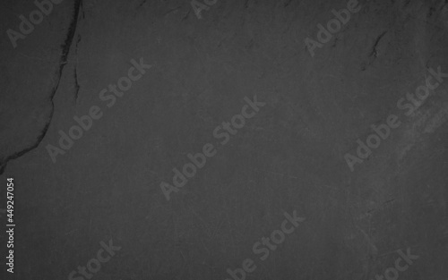 Beautiful background of a dark slate stone in close-up. Ideal for culinary or product presentation project.