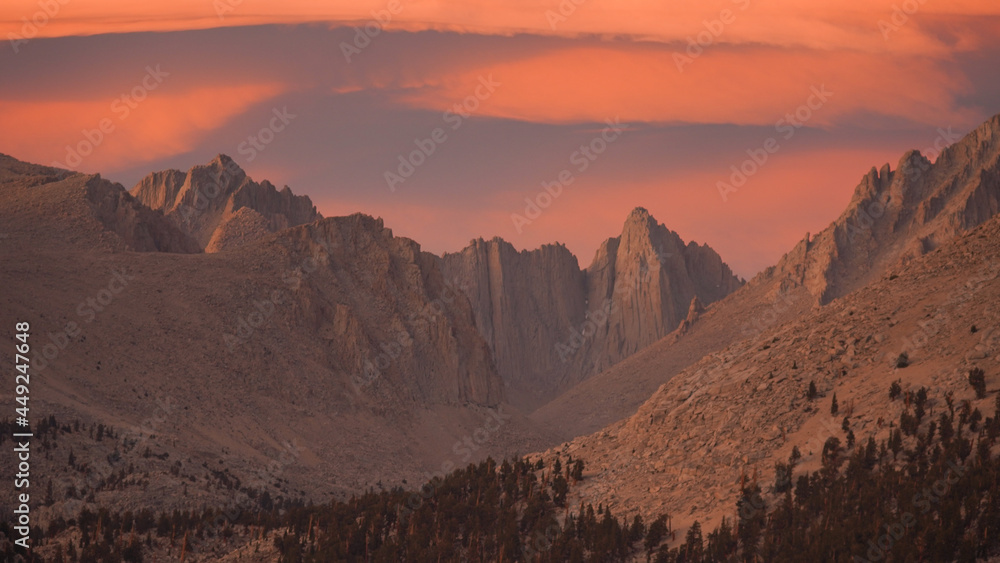 Sunset with dramatic clouds over Mount Whitney on the Pacific Crest Trail seen from Crabtree Meadows along the PCT California Section G from Walker Pass in the USA.
