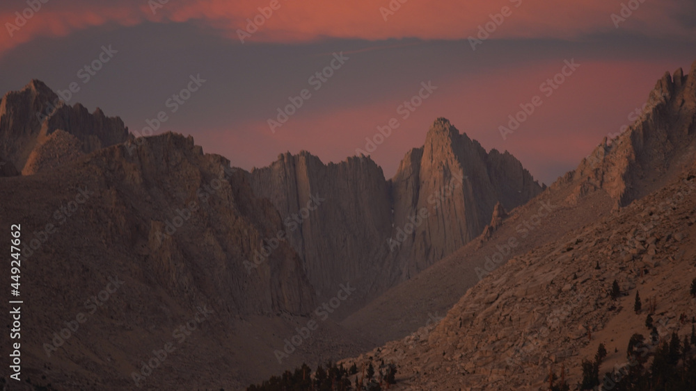 Sunset with dramatic clouds over Mount Whitney on the Pacific Crest Trail seen from Crabtree Meadows along the PCT California Section G from Walker Pass in the USA.