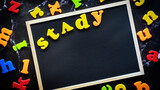 Back to school concept. Text Study on Black blackboard with coloful letters.