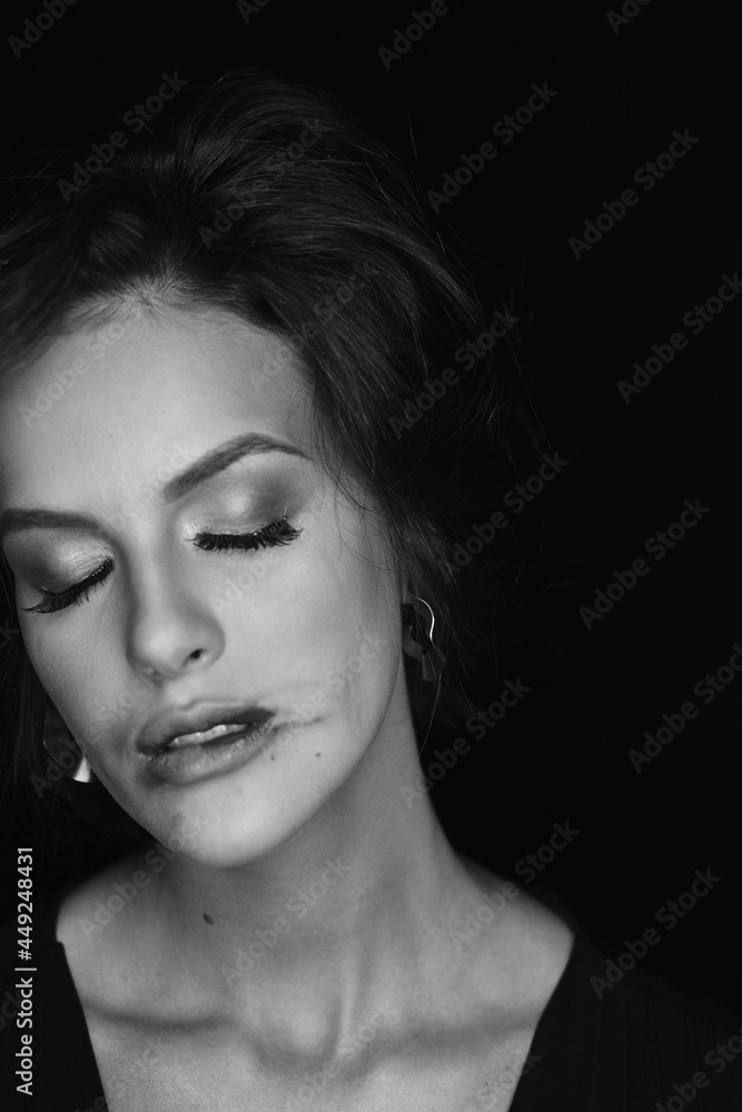 Editorial black and white photo, sensual woman, face, makeup.black background, professional photo.