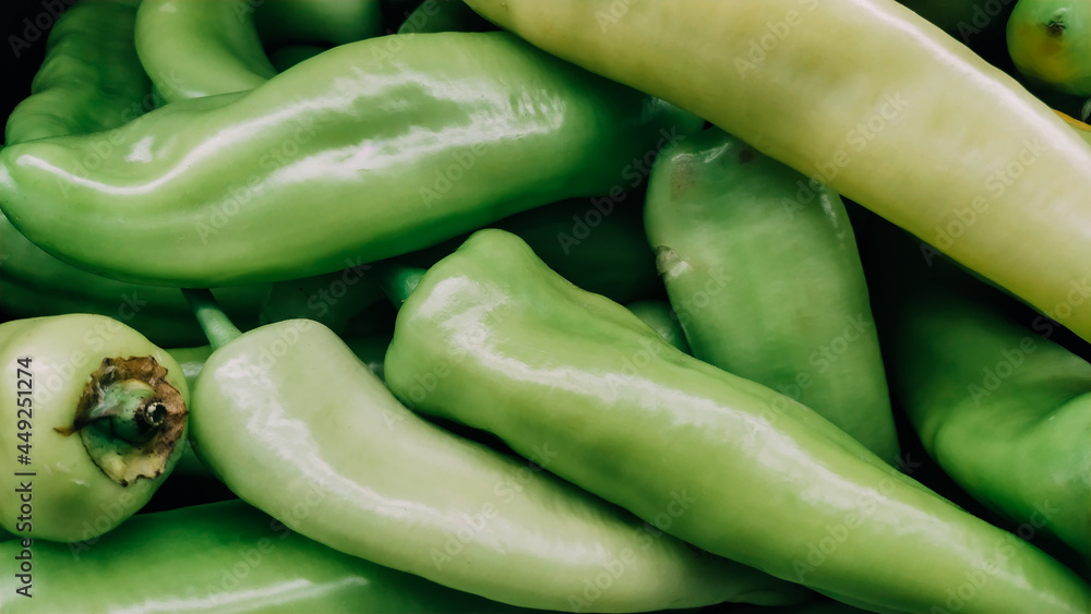 Green chili peppers stacked texture background Green chili peppers stacked texture background