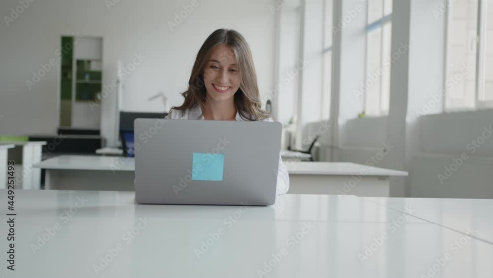 Close up view of smiling woman in office Close up view of smiling woman in office