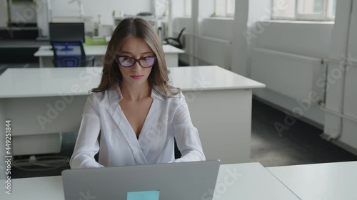 Hard work of young lady in office company photo