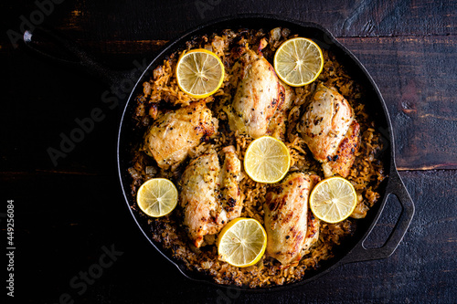 Obraz na płótnie Greek Chicken and Lemon Rice Served in a Cast Iron Skillet: Boneless Skinless ch