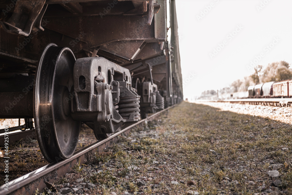 Freight train carriages. Close up of railway wheels. Railway transport system.
