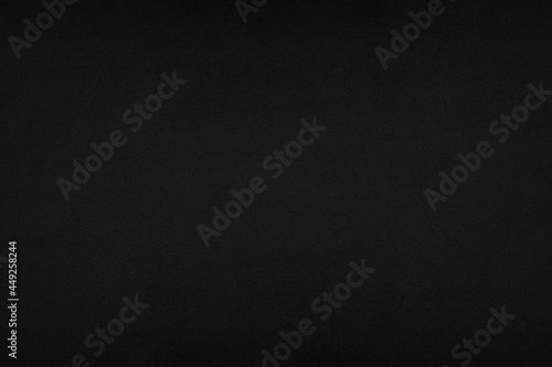 black background of coated board, painted surface. Background, texture