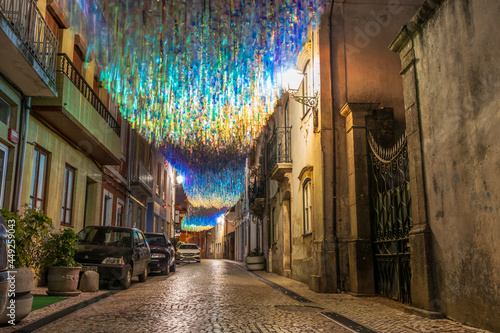 Colorful ribbons in the street during the Agitágueda street festival in Agueda, Portugal