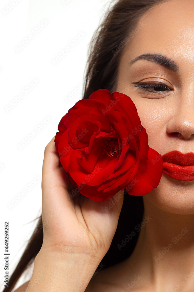 Half a beauty portrait with beautiful fashionable evening make-up, black smoky eyes and extremely long eyelashes. Red lipstick on the lips. Cosmetology and spa facial skin care Half a beauty portrait with beautiful fashionable evening make-up, black smoky eyes and extremely long eyelashes. Red lipstick on the lips. Cosmetology and spa facial skin care