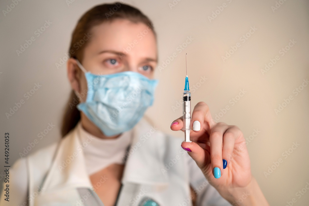 The doctor is going to give the vaccine to the patient. Reliable protection against disease coronavirus, corona, covid-19. Treatment and prevention of serious illness. Ambulance for pneumonia. Syringe The doctor is going to give the vaccine to the patient. Reliable protection against disease coronavirus, corona, covid-19. Treatment and prevention of serious illness. Ambulance for pneumonia. Syringe