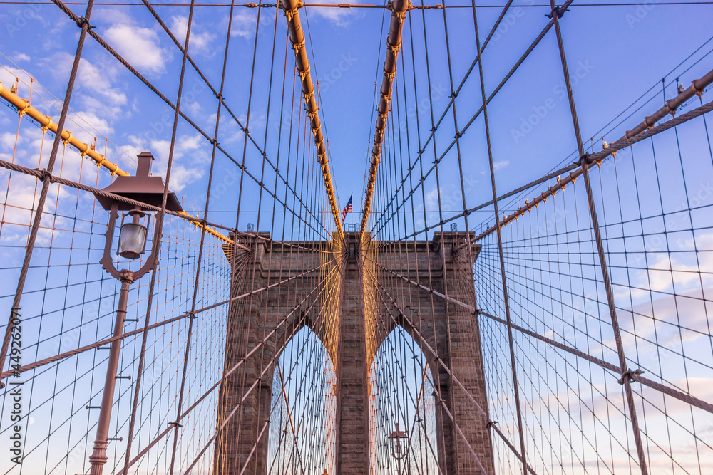 Obraz premium Brooklyn bridge with tourists in Manhattan island, New York, USA