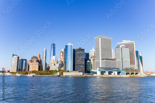 A picture of Manhattan skyline with Battery Park and Maritime terminals, bridges and Brooklyn, NY, USA
