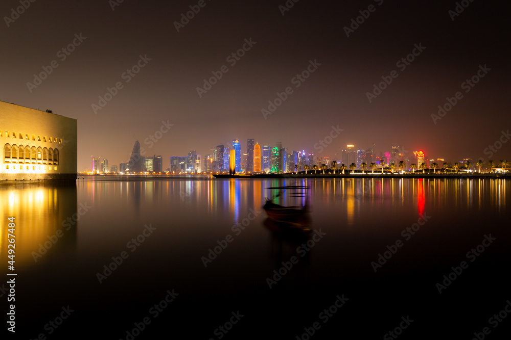 Illuminated skyline of Doha with Museum of Islamic Art at night, Qatar, Middle East.