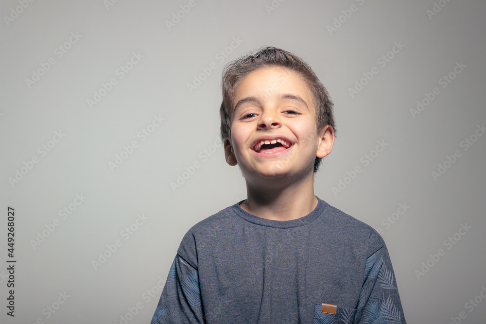 Funny child boy laughing on a white background. Funny child boy laughing on a white background.