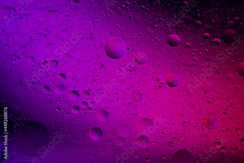Abstract background similar to drops of water, the result of mixing water and oil. Full color. Abstract colorful circles wallpaper. Macro photograpy.