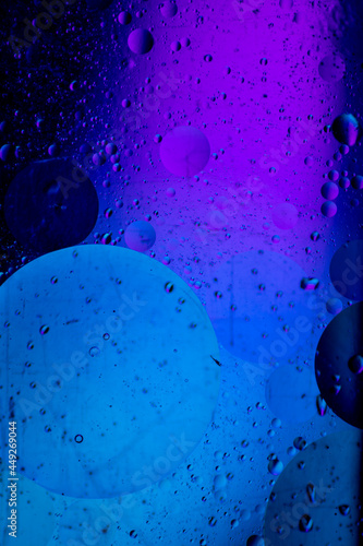 Abstract background similar to drops of water, the result of mixing water and oil. Full color. Abstract colorful circles wallpaper. Macro photograpy.