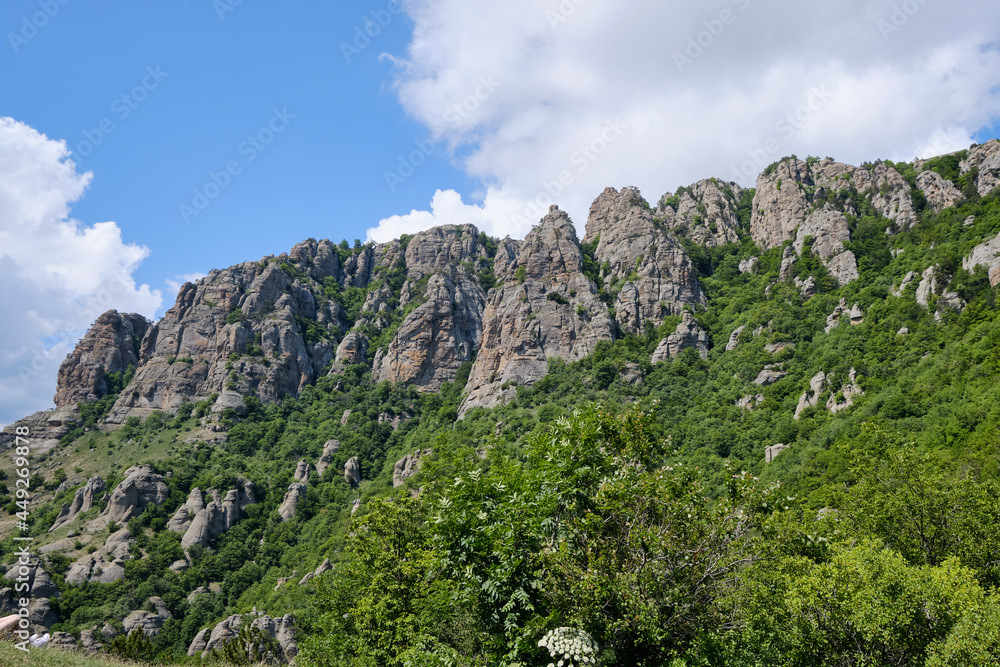 A wall of stone cliffs over the Valley of Ghosts. Demerdzhi mountain range, Crimea.