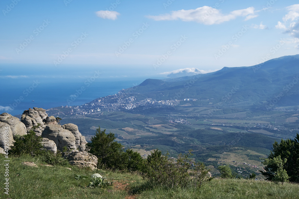 View from the observation deck near Mount Demerdzhi to the Black Sea and the valley near the city of Alushta. Crimea. View from the observation deck near Mount Demerdzhi to the Black Sea and the valley near the city of Alushta. Crimea.