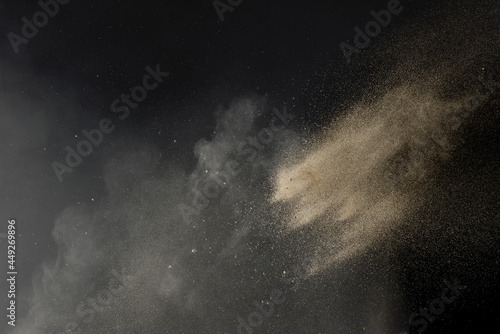 Sand thrown with sand dust and fine particles