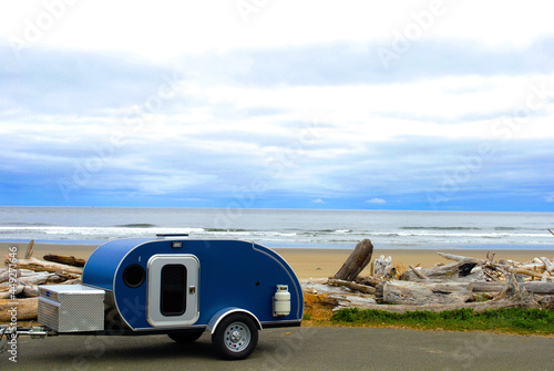 Wallpaper Mural Blue Teardrop camping trailer at the beach