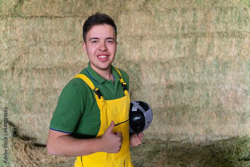 portrait of a young worker smiling when is working portrait of a young worker smiling when is working