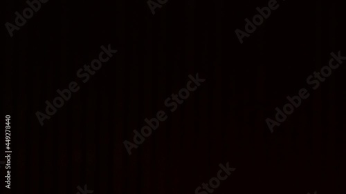 Beautiful hat dressed girl dancing latin dance . Professional female dancer dancing flamenco , rumba or salsa on red background with lines . Spanish dance movements . Shot ARRI ALEXA Cinema Camera .