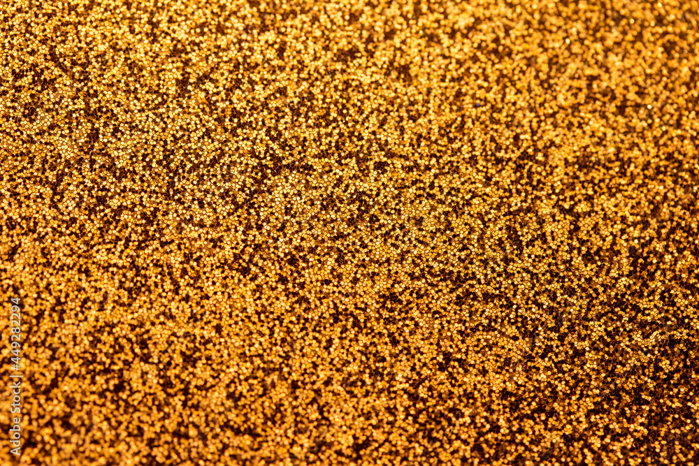 Autumn gold shiny glitter texture background with vibrant color Autumn gold shiny glitter texture background with vibrant color
