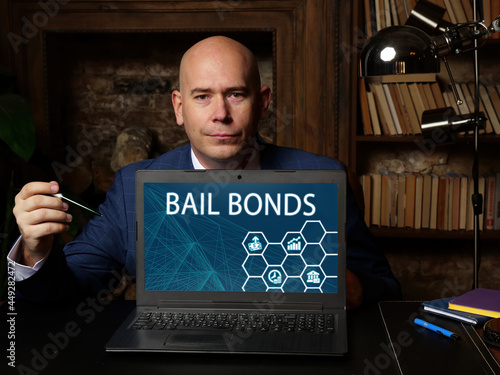 Business concept meaning BAIL BONDS with inscription on the screen. Conceptual photo showing an agreement by a criminal defendant to appear for trial or pay a sum of money set by the court