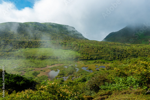 大分県玖珠郡九重町、竹田市久住町のくじゅう連山を登山している風景 A scene of climbing the Kujyu mountain range in Kusu-gun, Kokonoe-machi and Takeda-shi, Oita Prefecture.  photo