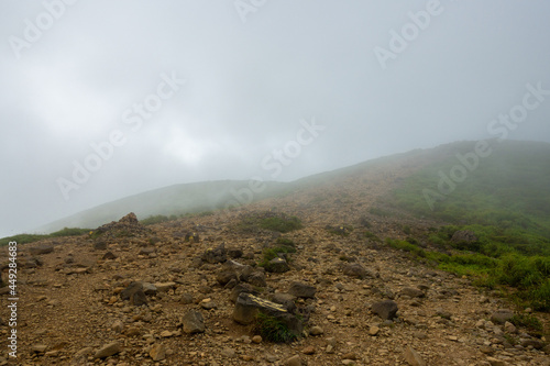 大分県玖珠郡九重町、竹田市久住町のくじゅう連山を登山している風景 A scene of climbing the Kujyu mountain range in Kusu-gun, Kokonoe-machi and Takeda-shi, Oita Prefecture.  photo