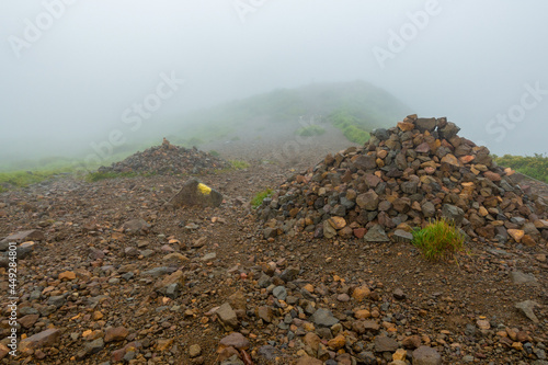 大分県玖珠郡九重町、竹田市久住町のくじゅう連山を登山している風景 A scene of climbing the Kujyu mountain range in Kusu-gun, Kokonoe-machi and Takeda-shi, Oita Prefecture.  photo