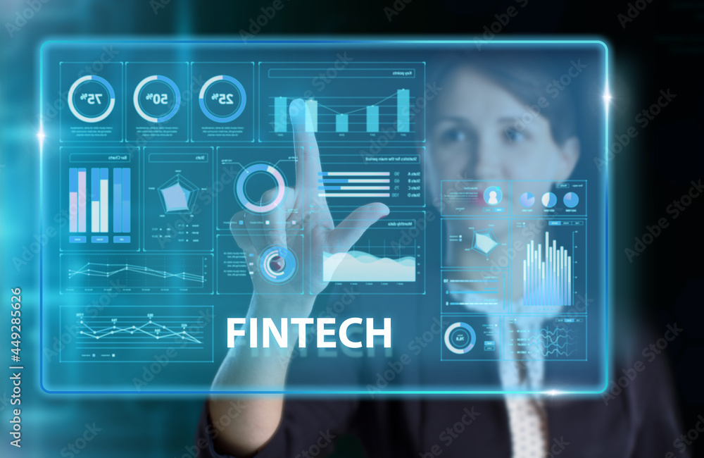 Fototapeta premium Business, Technology, Internet and network concept. Young businessman working on a virtual screen of the future and sees the inscription: Fintech
