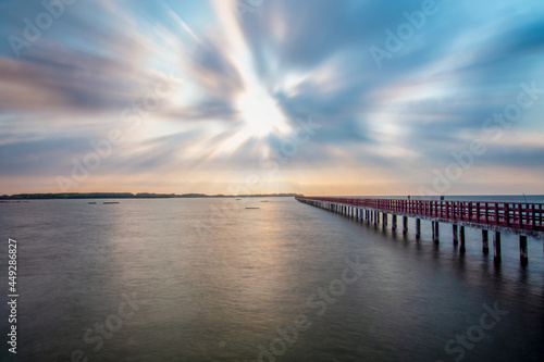 sunset over the pier © Jirayu