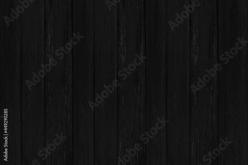 Old black vintage wooden wall pattern and seamless background