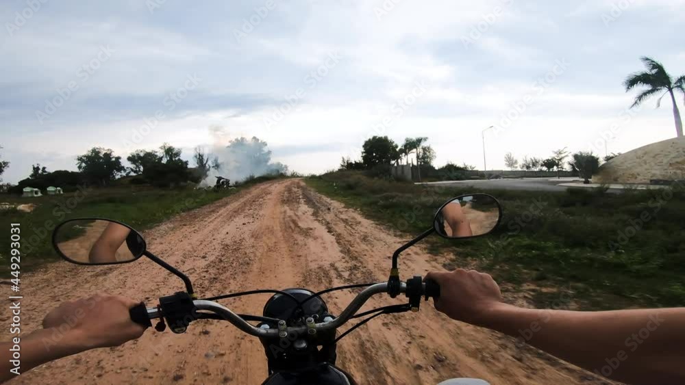 Riding motorbike through gravel road of Vietnam, POV view Riding motorbike through gravel road of Vietnam, POV view