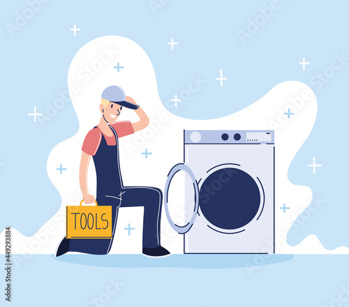 worker repairing washing machine