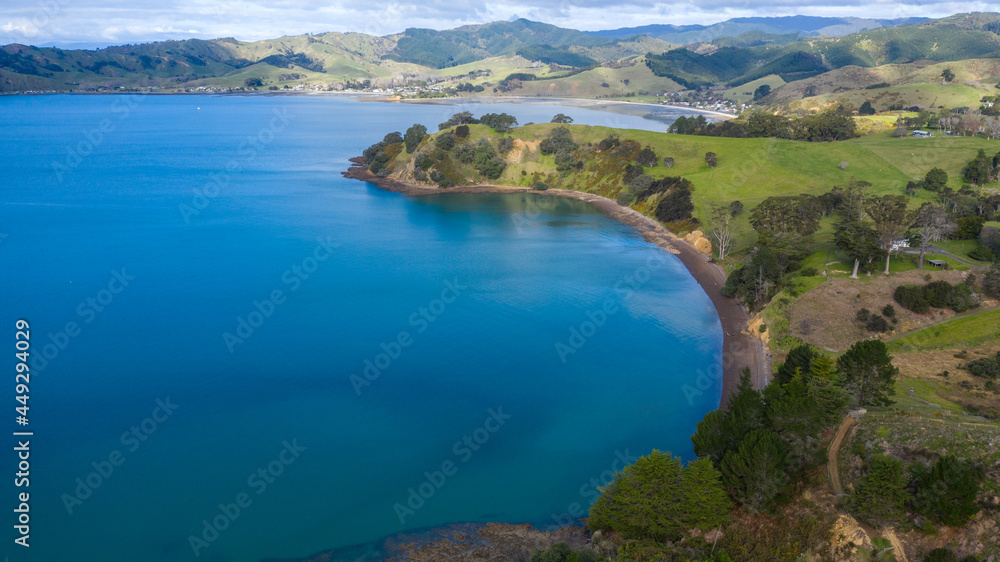Aerial View of Waitawa Regional Park, Beach, Pier, Deck Green Trees and Cliff in New Zealand - Auckland Area Aerial View of Waitawa Regional Park, Beach, Pier, Deck Green Trees and Cliff in New Zealand - Auckland Area
