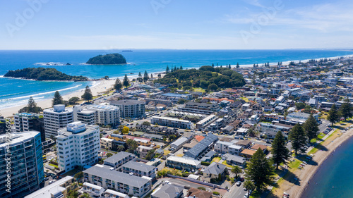 Aerial View from Houses close to the Beach, Green Trees, Mountain, Mount Maunganui, Boats in Tauranga, New Zealand  - Bay of Plenty photo