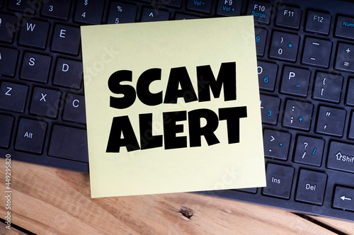 Scam Alert word with keyboard