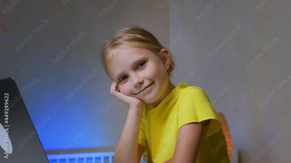 Portrait of a little schoolgirl smiling Stock Video | Adobe Stock