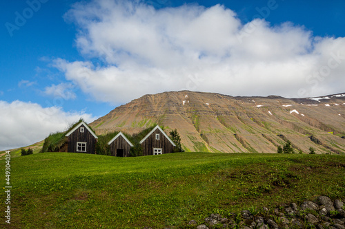 Icelandic turf houses in blue sky