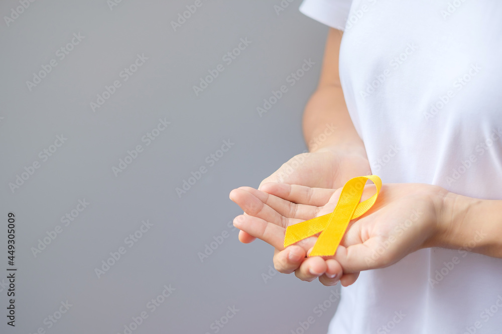 Obraz premium Suicide prevention day, Sarcoma, bone, bladder and Childhood cancer Awareness month, Yellow Ribbon for supporting people living and illness. children Healthcare and World cancer day concept
