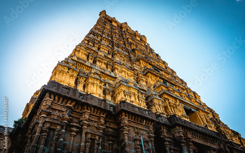 Entrance tower ( Gopuram) of Varadharaja Perumal Temple and Lord Atthi Varadar Perumal god statue inside the pond, Kanchipuram, Tamil Nadu, South India - Religion and Worship scenario image