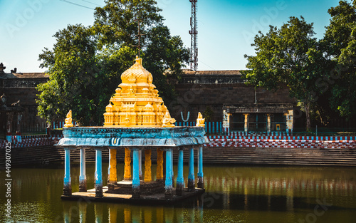 The Great Pond of Varadharaja Perumal Temple and Lord Atthi Varadar Perumal god statue inside the pond, Kanchipuram, Tamil Nadu, South India - Religion and Worship scenario image. Indias Best Tourism photo